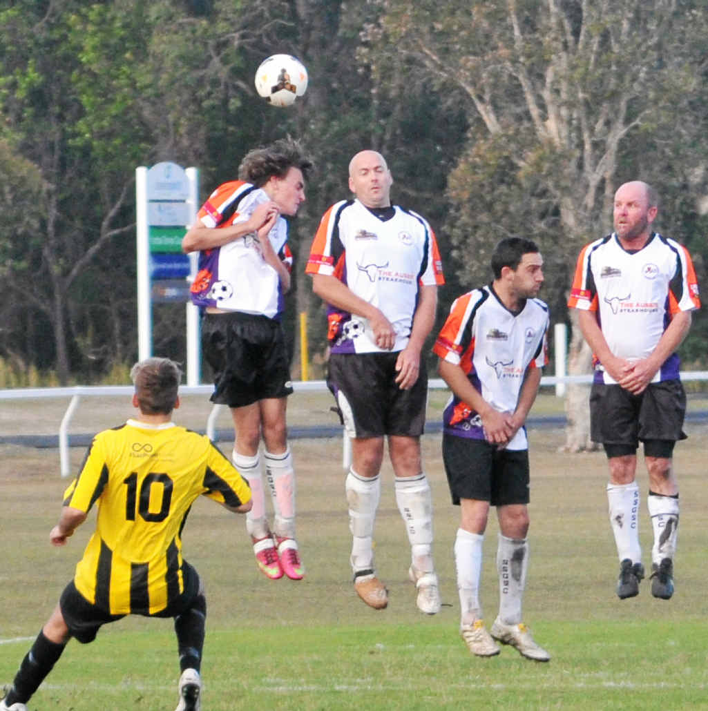 WALL BREACHED: South Services Gunners players put up a resistance to a Yamba free kick during the NCF 2nd Division North grand final at Angourie Sports Complex on Saturday. Photo: Leigh Jensen WALL BREACHED: South Services Gunners players put up a resistance to a Yamba free kick during the NCF 2nd Division North grand final at Angourie Sports Complex on Saturday. Photo: Leigh Jensen